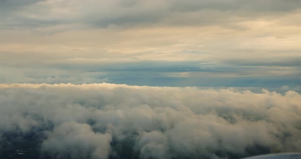 Clouds and Sky View From the Plane Flies High in the Sky Above the Rain Clouds alt