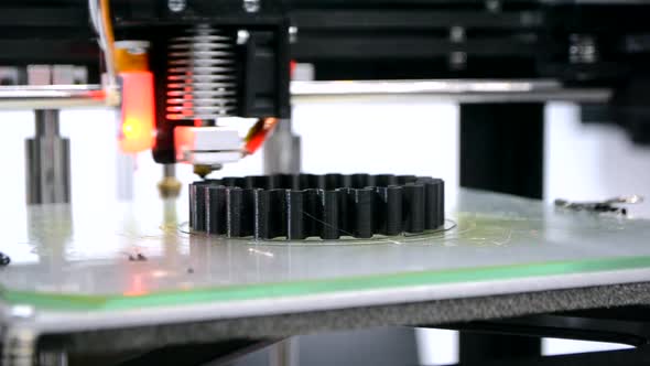 3d Printer Prints Black Object Closeup alt