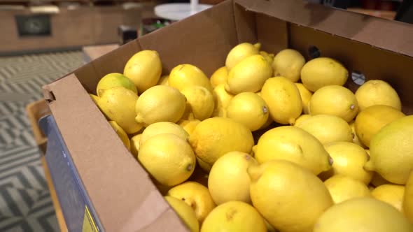 Pick Up the Fruit at the Store. Man Chooses Fresh CITRUS To Buy. alt