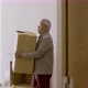 Mature Wife and Husband Entering New House with Cardboard Boxes - VideoHive Item for Sale