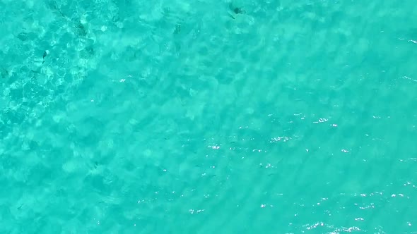 Aerial drone landscape of resort beach break by clear ocean with sand background alt