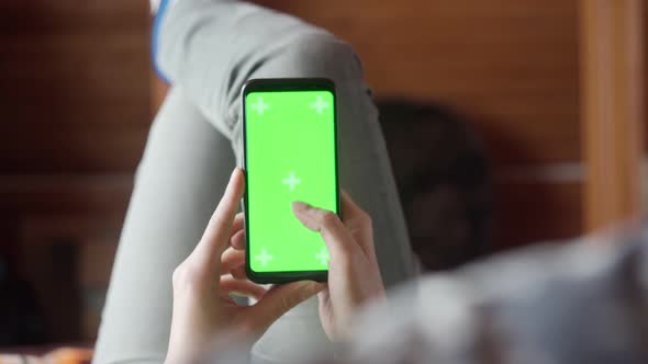 Young Woman at Home Lyung and Use Smartphone with Green Screen