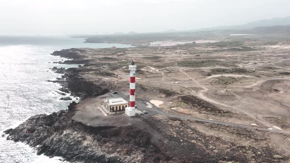 Tenerife Canary Islands Lighthouse at the Atlantic Ocean Alog the Volcanic Cliffs Rocky Coastline alt