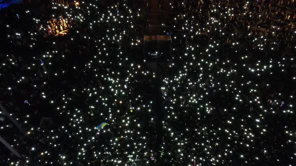 Celebration For The City Of Urkaina Rivne. Many People With Lights In Their Hands.