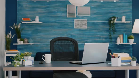 Bright Modern Living Room with Nobody in It with Blue Furniture and Walls alt