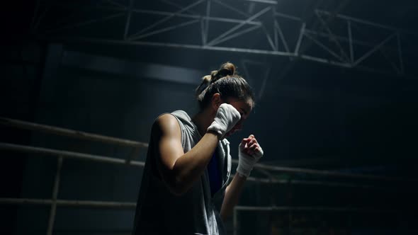 4K Asian woman boxer practicing boxing exercise punching the air in ...