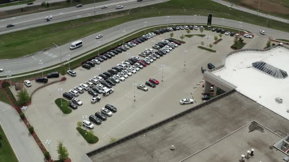 Aerial Drone Shot of the Car Carrier Trailer Car Hauler Loads Cars on the Trailer on Parking of the alt