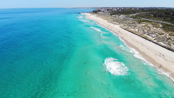 Aerial view of a Surfers at a Beach in Australia alt