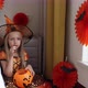 Cute Caucasian Little Girl with Blonde Hair Seven Years Old in Witch Dress and Hat Having Fun and - VideoHive Item for Sale