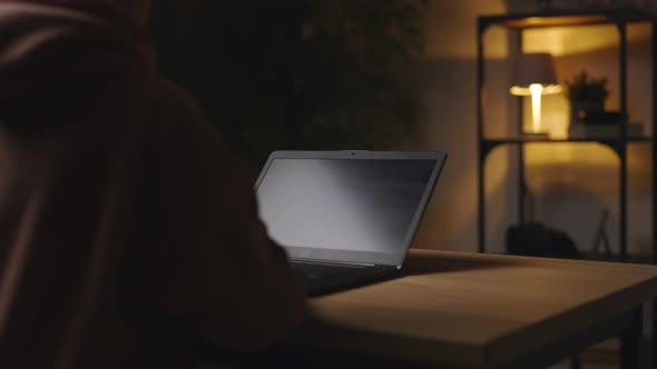 Woman Working Late on Laptop