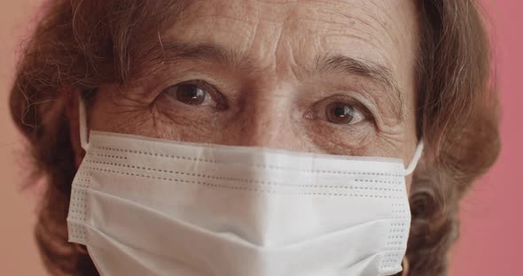 Elderly Woman Wearing Protection Mask alt
