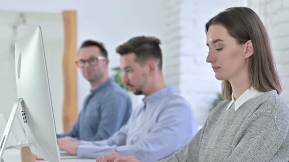 Serious Startup Team Looking at the Camera One By One alt