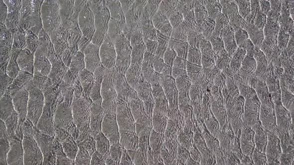 Beautiful background, water ripples in the shallow sand. Top view.