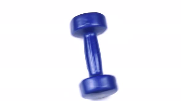 Blue dumbbell for fitness on a white background