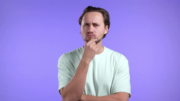 Thinking Man Looking Up and Around on Violet Background