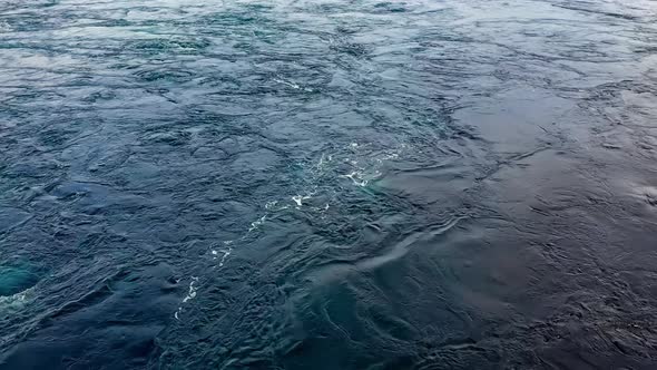 Waves of Water of the River and the Sea Meet Each Other During High Tide and Low Tide alt