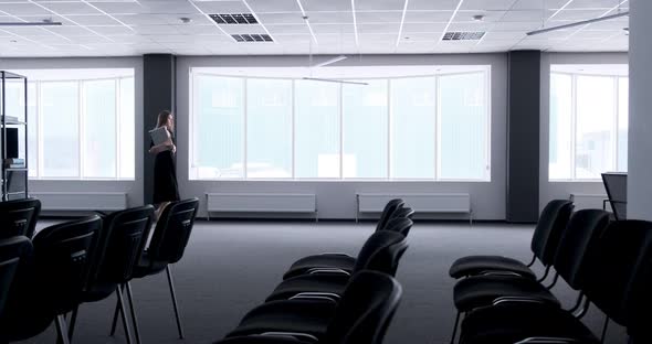 Silhouette of Young Business Woman Walking in Office Hall Corridor, Serious Attractive Female Goes alt