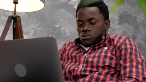 Adult African American Man Freelancer Works for Laptop Typing Text on Keyboard alt