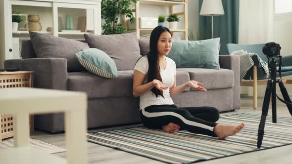 Attractive Young Girl Vlogger Is Talking in Front of Camera Recording Video for Online Blog in alt