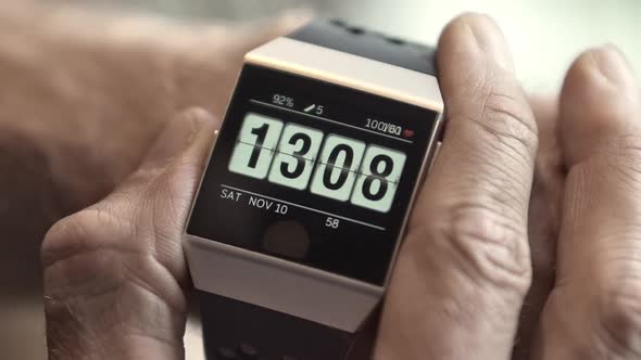 Smartwatch Screen Turning on Showing the Time Changing By the Second alt