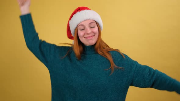 Young Woman in Red Sweater Santa Christmas Hat Dancing Fooling Around Having Fun