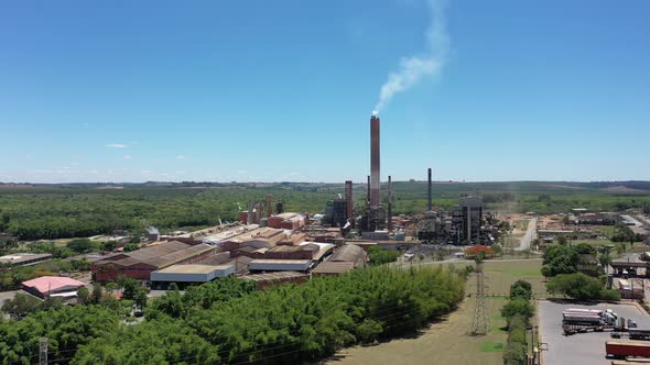 Toxic gas smoke from paper industrial factory. Air pollution. alt