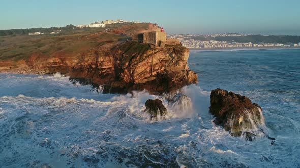 Aerial View of Lighthouse and Big Waves, Portugal by Kokhanchikov