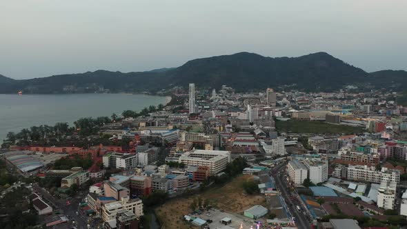 Drone Flight Over the Jungle and Sea City After Sunset