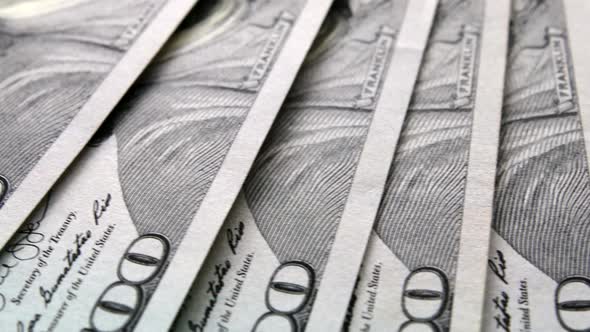 US Hundred Dollar Bills are Fanned Out alt