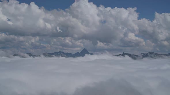Rocky Peaks of Andean Andes Mountain Ranges High Above the Clouds