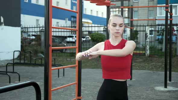 Fit Sporty Caucasian Pretty Girl Workout in Sportswear Outdoors at Sports Ground