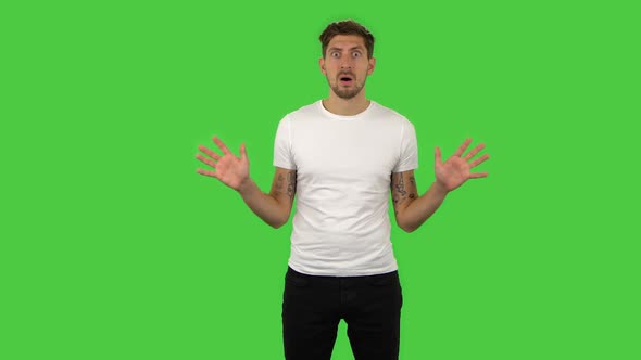 Confident Frustrated Guy Is Saying Wow with Shocked Facial Expression. Green Screen alt