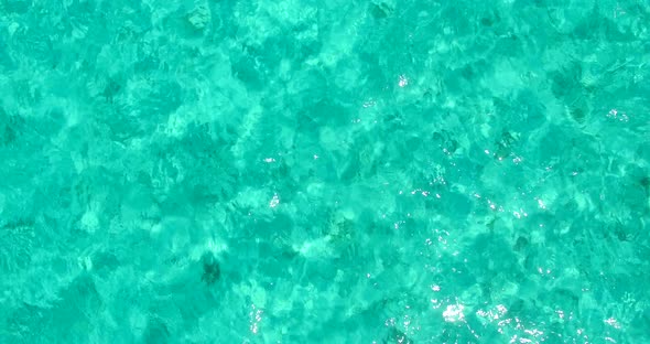 Daytime overhead abstract view of a sunshine white sandy paradise beach and blue sea background in h alt
