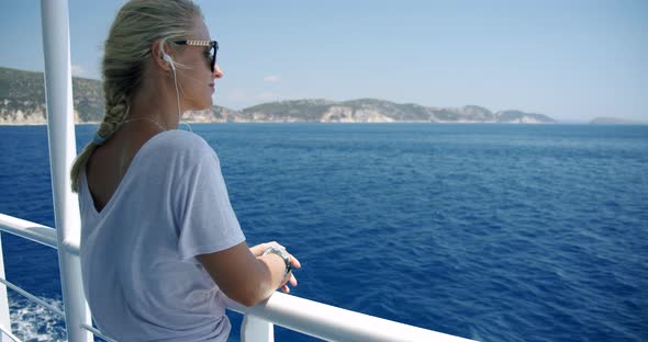Young Blonde Woman Enjoying View on Travel at Sea on Cruise Ship Vacation alt