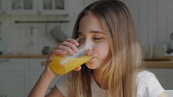 Portrait Caucasian Little School Girl Child Daughter Preteen Kid Feels Thirsty Drinks Orange Juice alt