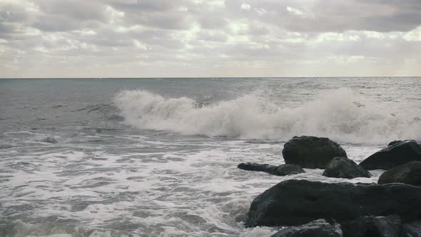  the Sun Makes Its Way Through the Clouds To the Troubled Sea