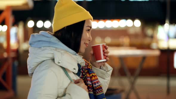 Woman enjoying holidays, walking and drinking hot tea