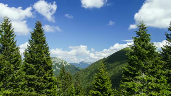 Time Lapse Clouds Move Over Mountain and Forest Rural Landscape alt