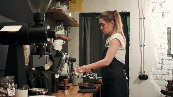 Barista making coffee with proffessional brewing coffee bar