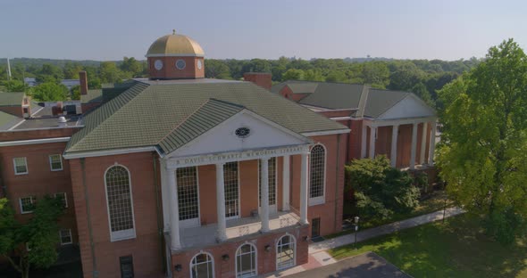 Rising Aerial Pan of a Colonial Architecture Style Building in Long Island alt