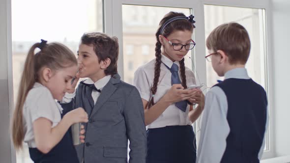 Schoolchildren Relaxing at Recess at School alt