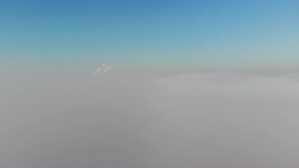 Flying on a Drone Above the Clouds