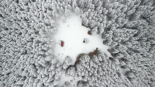 Aerial Top Down Shot of Mountain Hut in the Middle of a Forest