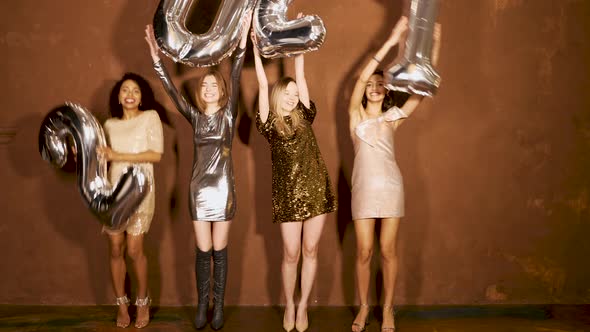 Beautiful Women Celebrating New Year.Happy Gorgeous Female In Stylish Sexy Party Dresses  alt