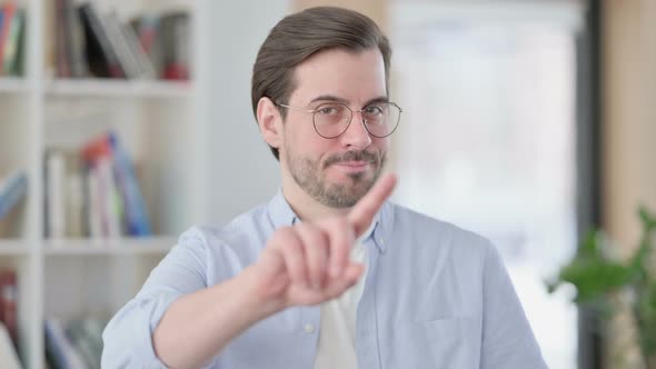Portrait of No Sign By Man in Glasses By Finger Gesture alt
