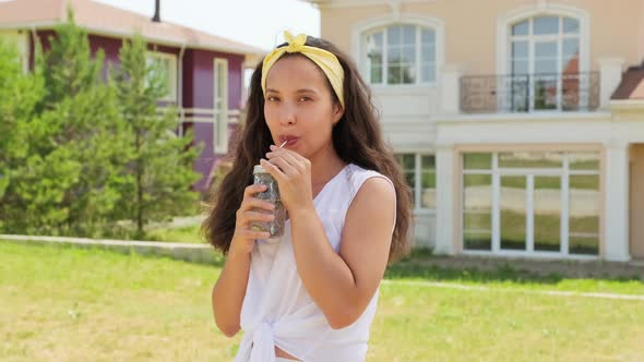 Portrait Of Beautiful Woman Drinking Lemonade alt