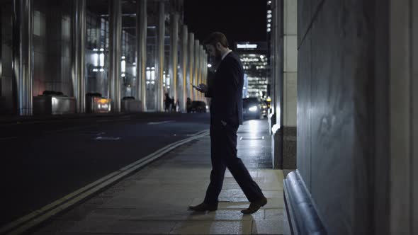 Business male waiting for Taxi outside office