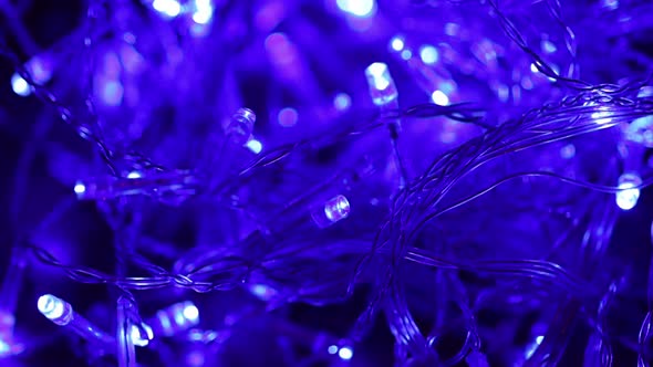 New Year's Garland with Blue Light Bulbs Close-up