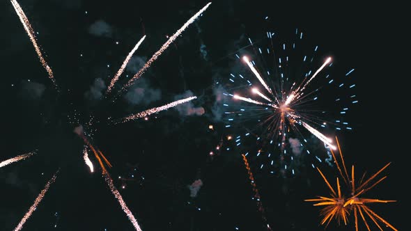 Fireworks Flashing in the Night Sky. Slow Motion. Real Fireworks with Smoke alt