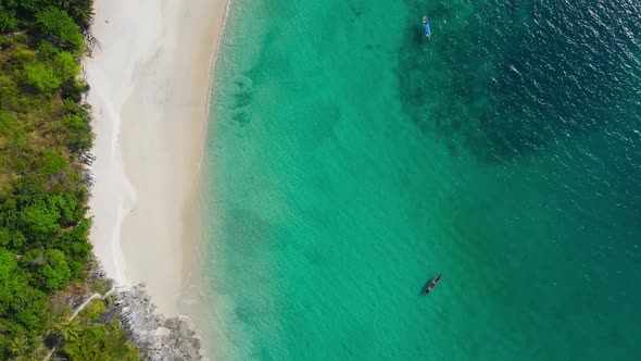 Aerial view of drone top view beach and seawater on sandy beach in summer. Nature and travel concept alt